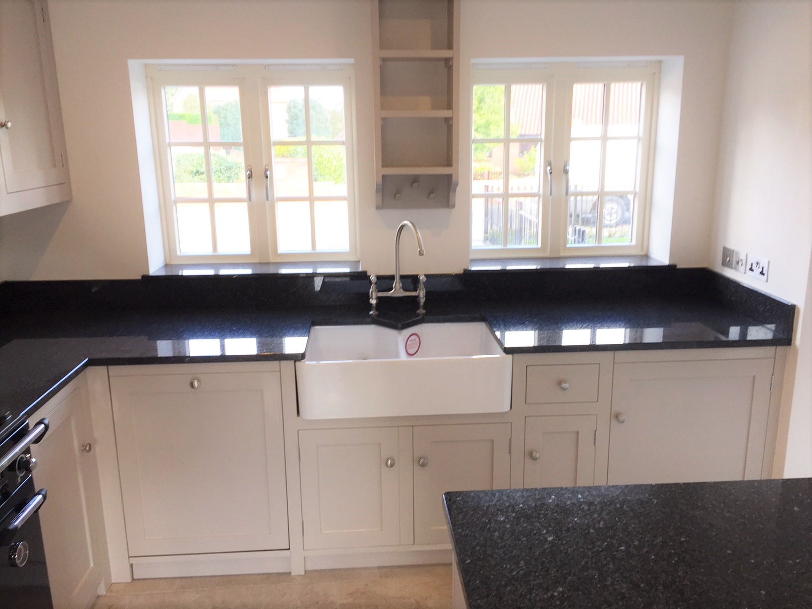 Fully bespoke, hand built from solid wood,shaker style kitchen painted in Farrow & Ball Elephants Breath