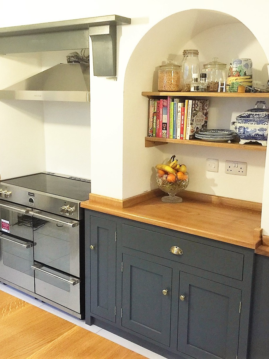 Tailor made, individual design shaker style kitchen hand made from solid wood here in Nottingham,painted in Farrow&Ball downpipe.Bespoke island site with wide plank solid oak surface top.